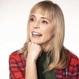 Maria Bamford poses with hand on chin.