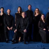 The Tallis Scholars stand together
