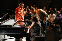 Stanley Clarke gives feedback to student pianist