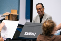 Stanley Clarke listens to students play