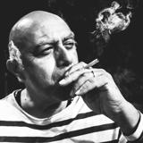 Herbert Siquenza as Pablo Picasso smoking cigarette